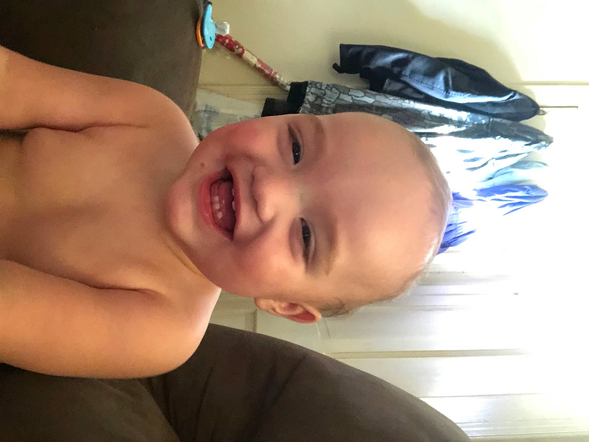 Lochlan is registered to the contest to win money with this photo: arm, baby, cheek, chest, eye, eyebrow, eyelash, finger, forehead, hair, happy, human_body, jaw, joy, lip, mouth, neck, nose, person, skin