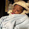 A Zyiss joined the competition — help win amazing prizes! newborn, baby, infant, child, portrait, sleepy, hat, animal_hat, blanket, bottle, baby_bottle, pacifier, swaddled, cozy, fluffy, face, indoors, close_up, seated, caregiving