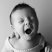 Louis participe au concours pour gagner de l'argent avec cette photo : baby, infant, portrait, black_and_white, yawning, close_up, sleepy, knitted_clothing, cute, newborn, face, expression, child, person, soft_light, monochrome, adorable, head, skin, peaceful