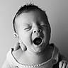 baby, infant, portrait, black_and_white, yawning, close_up, sleepy, knitted_clothing, cute, newborn, face, expression, child, person, soft_light, monochrome, adorable, head, skin, peaceful