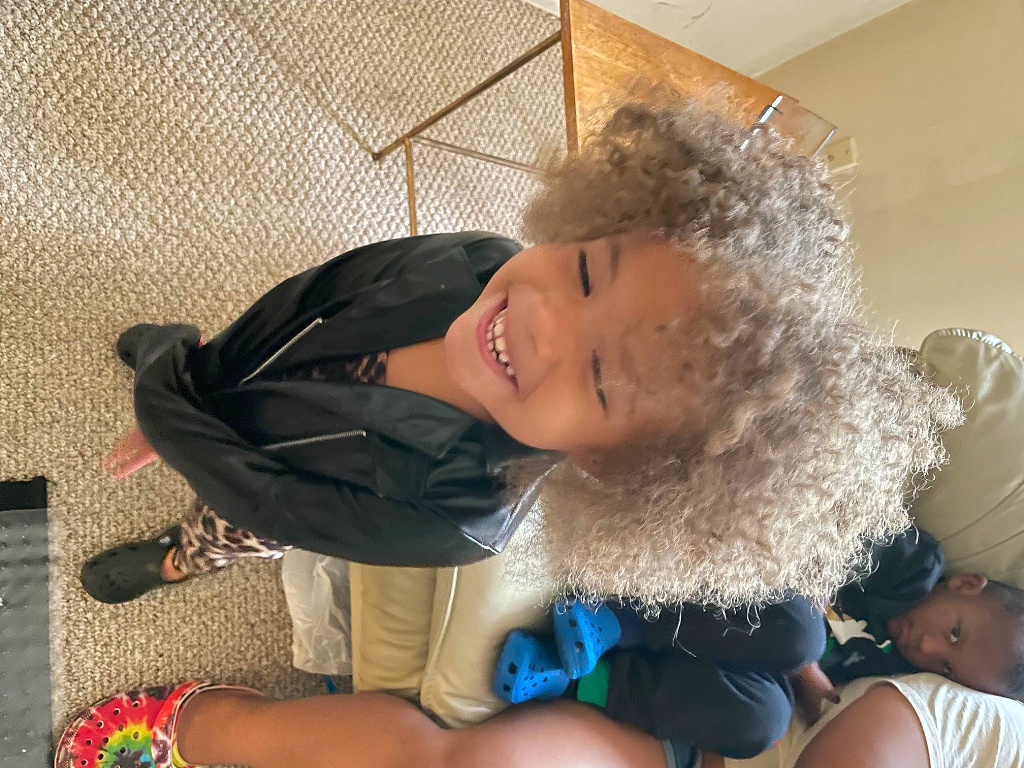 Jana is registered to the contest to win money with this photo: abdomen, baby, child, comfort, event, fun, fur, happy, human_leg, joy, lap, leisure, person, room, sitting, smile, thigh, toddler, vacation, winter