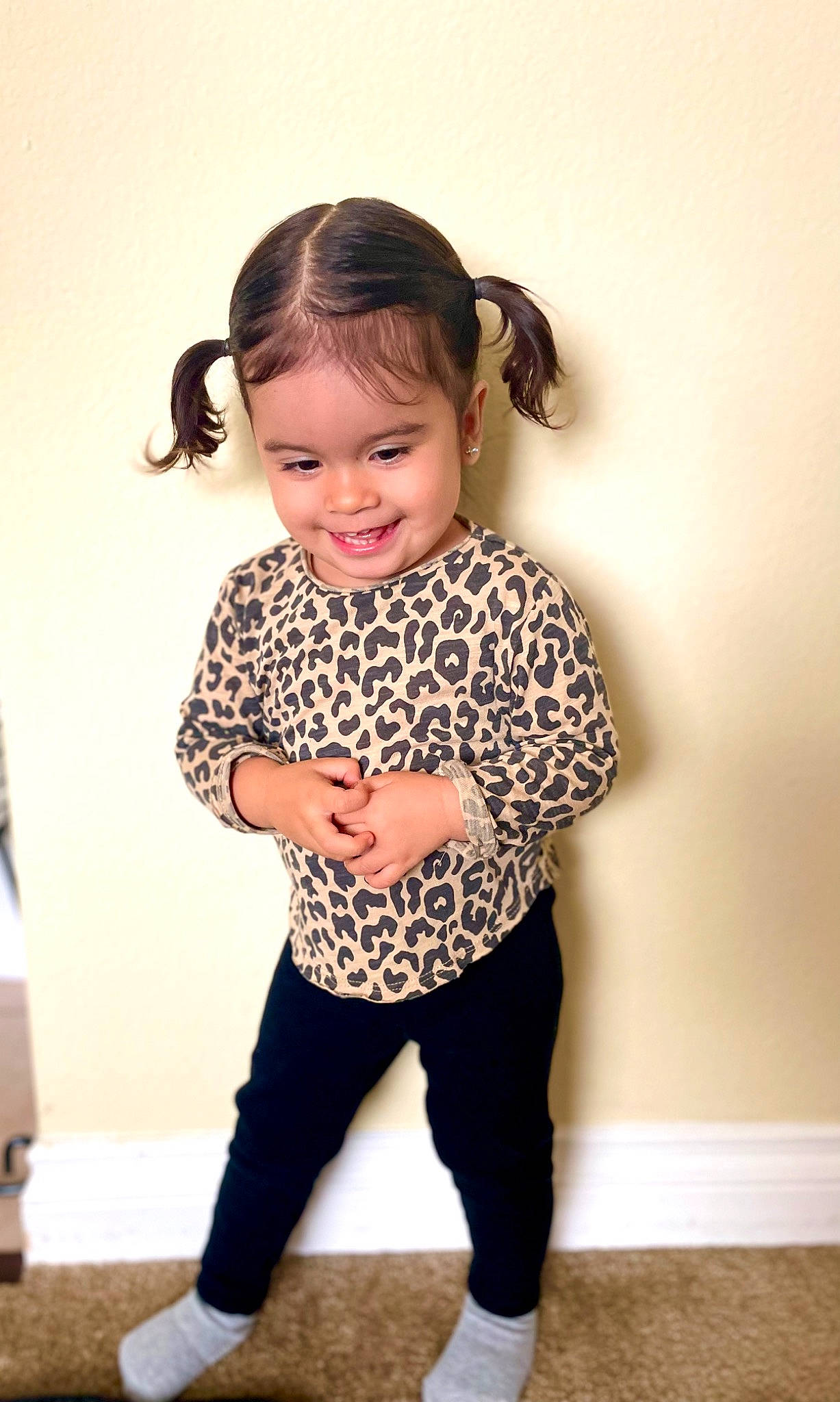 Angie is registered to the contest to win money with this photo: baby_toddler_clothing, cool, face, facial_expression, hair, hairstyle, happy, human_body, iris, joy, knee, leg, neck, person, shoulder, skin, sleeve, smile, standing, t_shirt