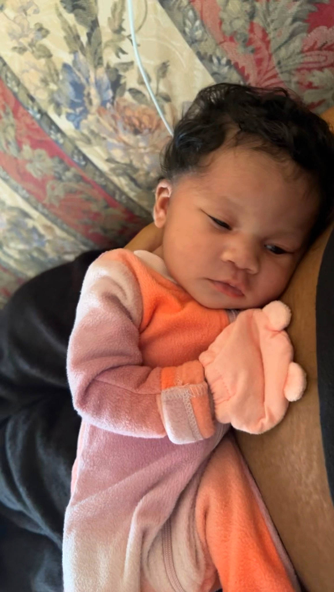 Chanel is registered to the contest to win money with this photo: arm, baby, baby_toddler_clothing, cheek, chin, comfort, eyebrow, face, facial_expression, finger, happy, iris, lip, mouth, neck, nose, person, skin, sleeve, textile