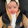 baby, car_seat, child, closeup, clothing, cute, face, happy, headband, indoor, infant, knitted, pacifier_clip, portrait, safety, seatbelt, smile, toddler, warm_clothing, wooden_beads