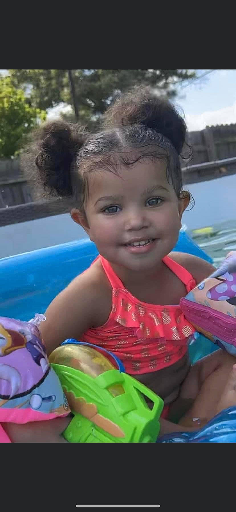 Khloe is registered to the contest to win money with this photo: baby_products, bathing, child, fun, green, happy, iris, joy, leisure, person, personal_protective_equipment, play, recreation, sitting, skin, smile, summer, swimming_pool, toddler, toy