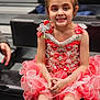 bodypart, child, clothing, costume, dress, eveningdress, face, female, finger, formalwear, girl, hand, happy, head, person, photography, portrait, sitting, skirt, smile
