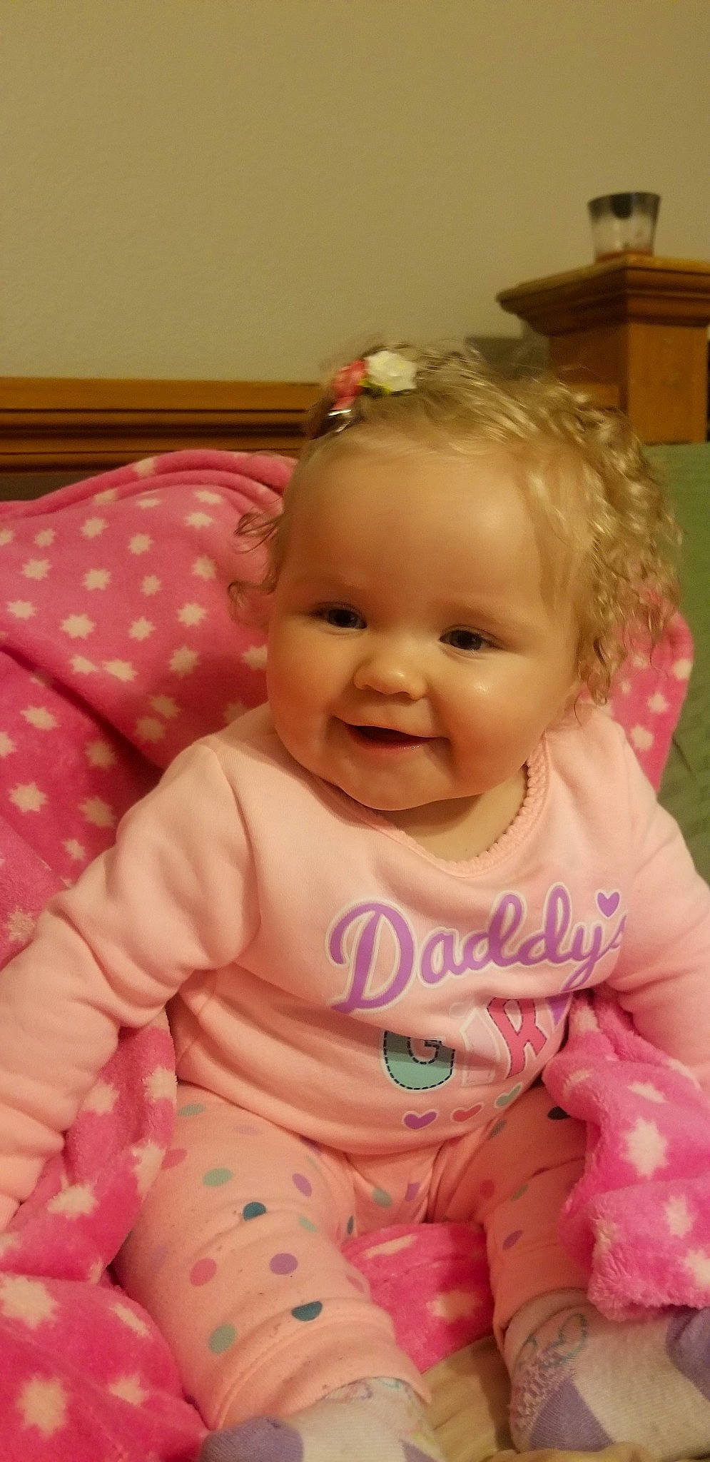 Heather is registered to the contest to win money with this photo: baby_products, cheek, child, day, eye, face, girl, head, human_hair_color, infant, iris, mouth, nose, person, pink, product, sitting, skin, smile, toddler