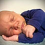 Grady joined the competition — help win amazing prizes! baby, sleeping, infant, blue_clothing, hand, face, peaceful, soft_texture, close_up, resting, newborn, skin, portrait, cozy, cute, young_child, indoors, peace, calm, sleep