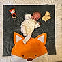 baby, infant, blanket, fox, toy, knitted_toy, wooden_toy, onesie, cute, lying_down, soft_texture, polka_dot, child, newborn, face, head, small, animal_design, indoor, resting