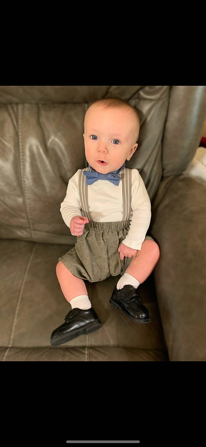 Dawson is registered to the contest to win money with this photo: baby, baby_toddler_clothing, cheek, child, comfort, couch, figurine, flash_photography, flooring, formal_wear, person, shoe, sitting, sleeve, sock, toddler, toy, wood