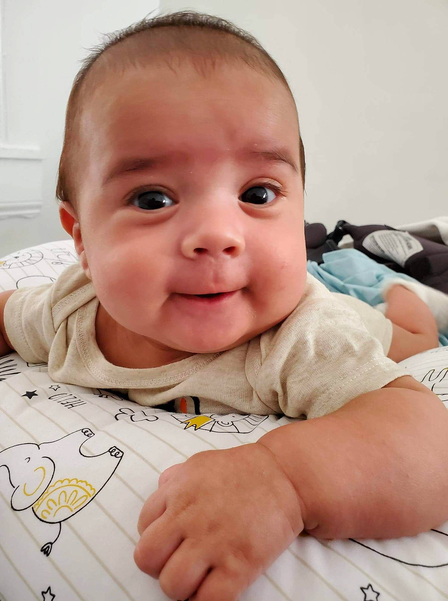 Emiliano joined the competition — help win amazing prizes! baby, cheek, child, eye, face, finger, forehead, head, lip, mouth, nose, person, skin, smile, toddler, tummy_time