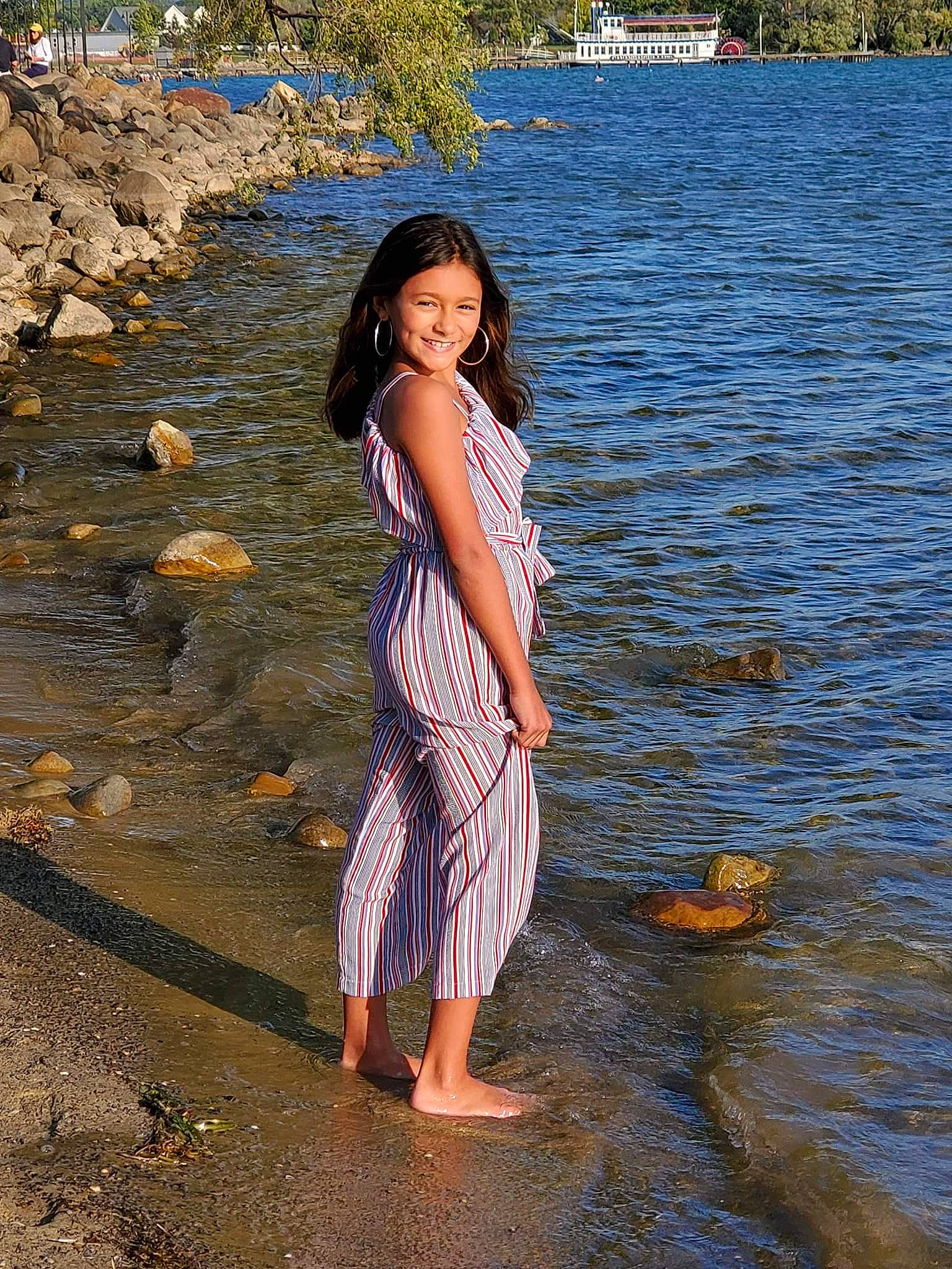 Ciara is registered to the contest to win money with this photo: bank, barefoot, beach, beauty, black_hair, dress, joy, leg, long_hair, model, people_in_nature, person, photo_shoot, photograph, photography, river, rock, sea, smile, summer