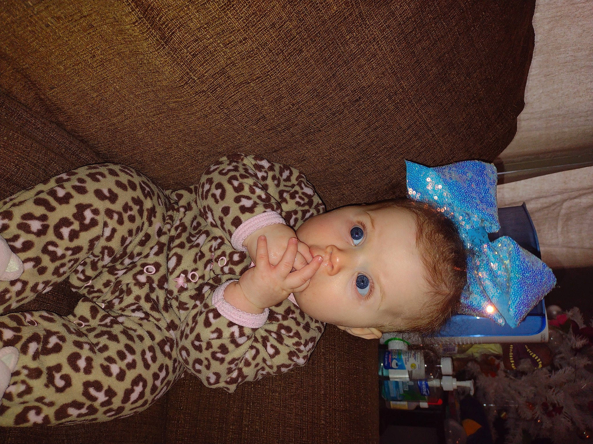 Lailah joined the competition — help win amazing prizes! baby, baby_products, baby_sleeping, baby_toddler_clothing, cheek, child, comfort, couch, ear, face, head, human_body, iris, nose, pattern, person, room, sitting, skin, sleeve