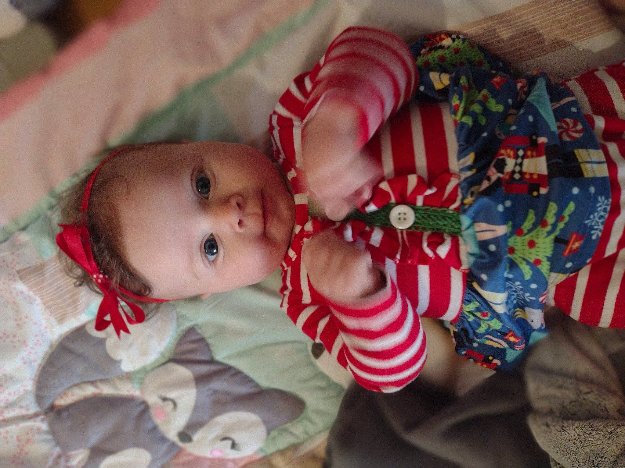 Lailah is registered to the contest to win money with this photo: arm, baby, baby_toddler_clothing, cheek, child, eye, face, hand, headgear, human_body, iris, lip, mouth, nose, pattern, person, product, skin, smile, textile