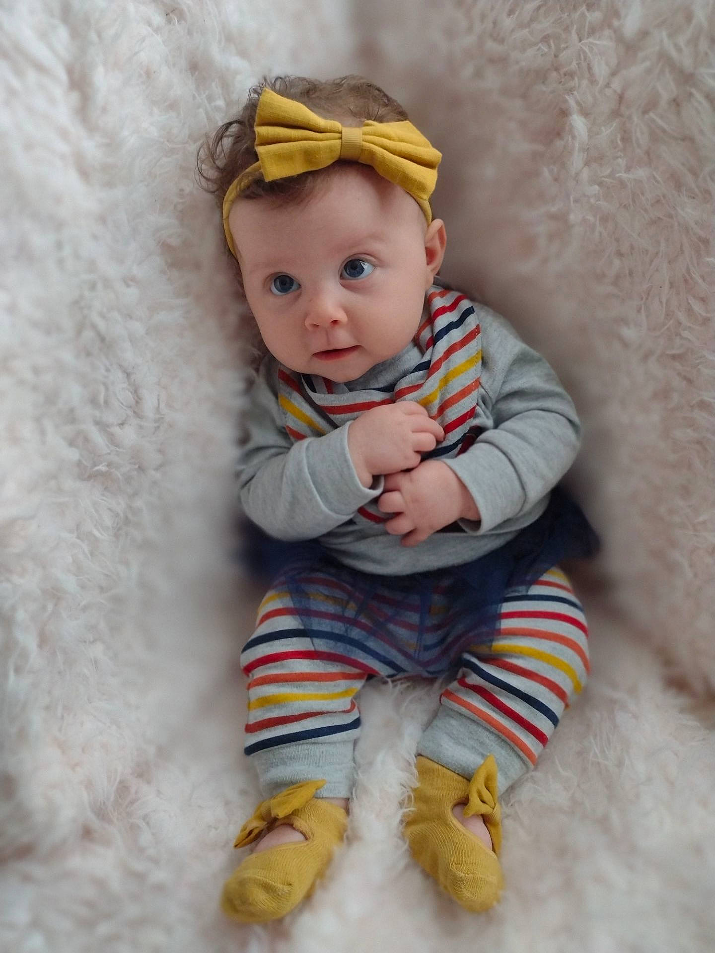 Lailah is registered to the contest to win money with this photo: arm, baby, baby_toddler_clothing, cheek, child, eye, fashion_accessory, hand, happy, head, iris, lip, nose, person, sitting, skin, sleeve, t_shirt, textile, toddler
