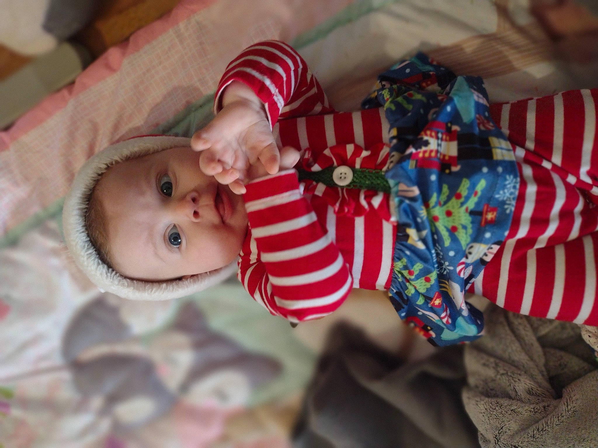 Lailah is registered to the contest to win money with this photo: baby, baby_products, baby_toddler_clothing, cheek, child, comfort, event, face, happy, head, linens, pattern, person, product, room, sitting, skin, sleeve, smile, toddler