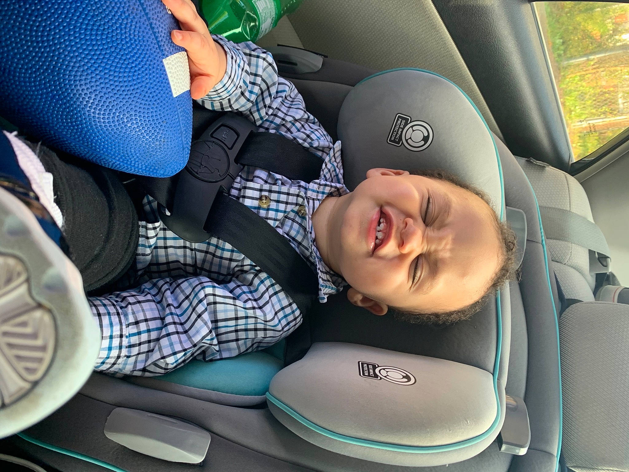 Kyndrick is registered to the contest to win money with this photo: auto_part, automotive_design, baby_in_car_seat, car, car_seat, car_seat_cover, comfort, head_restraint, mode_of_transport, motor_vehicle, people, person, product, seat_belt, smile, steering_part, steering_wheel, toddler, vehicle, vehicle_door