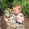 Jameson joined the competition — help win amazing prizes! toddler, child, outdoor, garden, plants, greenery, stone_path, sunlight, pajamas, sitting, nature, daylight, curious, young_child, playful, casual_clothing, barefoot, baby, happy, peaceful