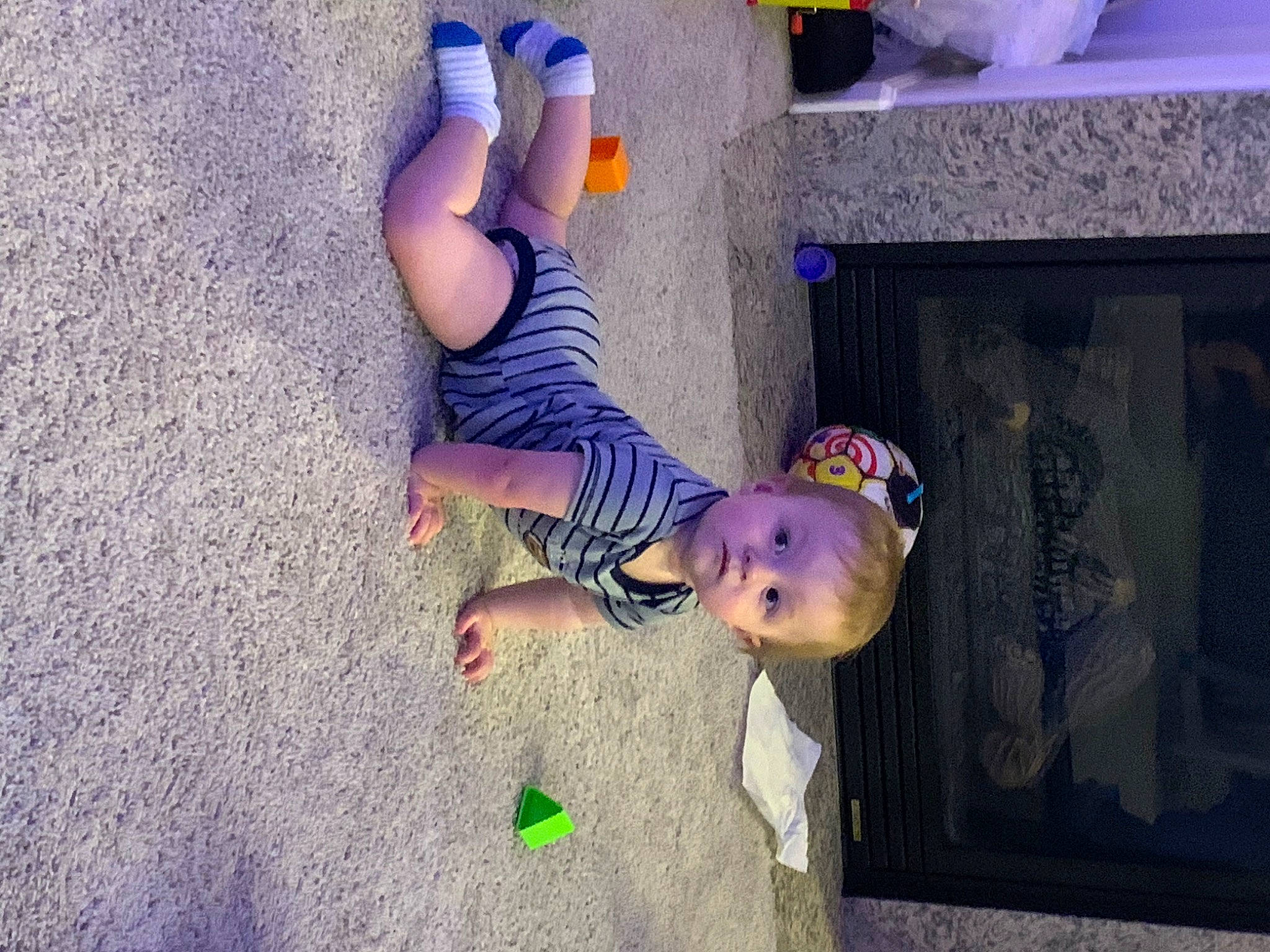 Kameron is registered to the contest to win money with this photo: baby, baby_toddler_clothing, child, electric_blue, flooring, foot, fun, human_leg, magenta, person, play, purple, shadow, sitting, toddler, vacation, visual_arts
