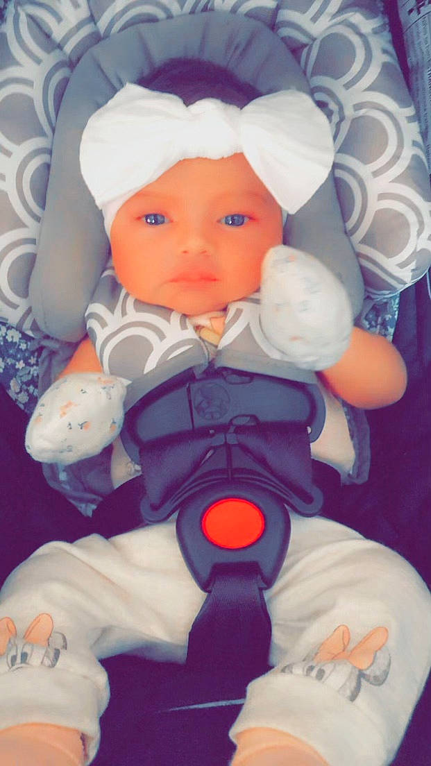 Madeline is registered to the contest to win money with this photo: baby, baby_products, baby_toys, carmine, cheek, child, doll, fictional_character, headwear, pattern, person, pink, plastic, plush, room, service, skin, stuffed_toy, textile, thumb