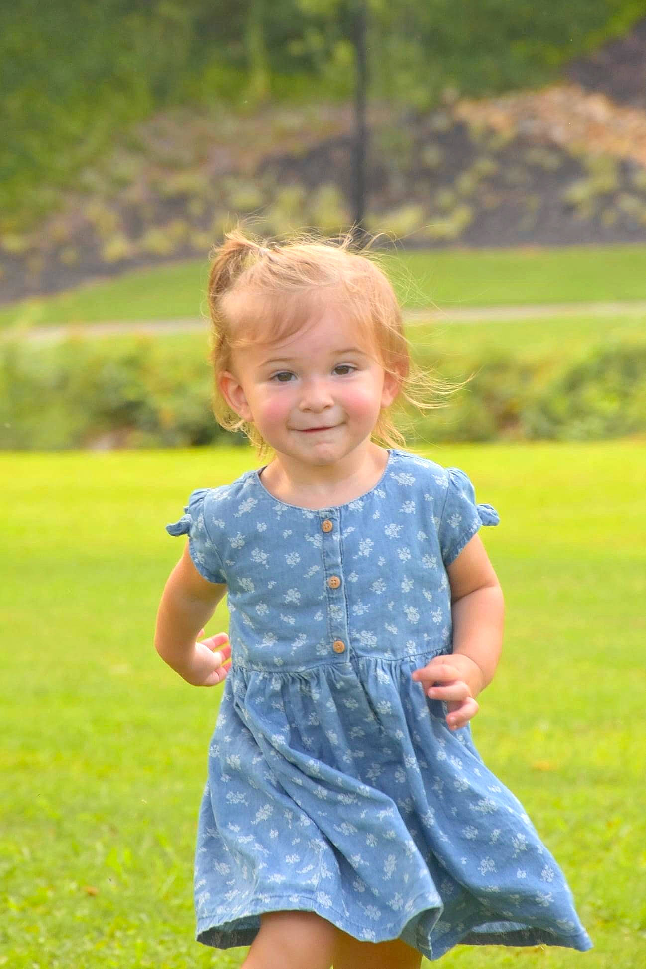 Emory joined the competition — help win amazing prizes! baby_toddler_clothing, clothing, day_dress, dress, face, facial_expression, gesture, grass, grassland, hairstyle, happy, joy, leaf, leisure, one_piece_garment, people_in_nature, person, plant, sleeve, smile