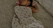 Izzariah is registered to the contest to win money with this photo: newborn, baby, sleeping, infant, portrait, blanket, swaddle, hearts, pink, mittens, bed, bedding, pillow, cozy, indoors, nursery, peaceful, relaxed, photography, face