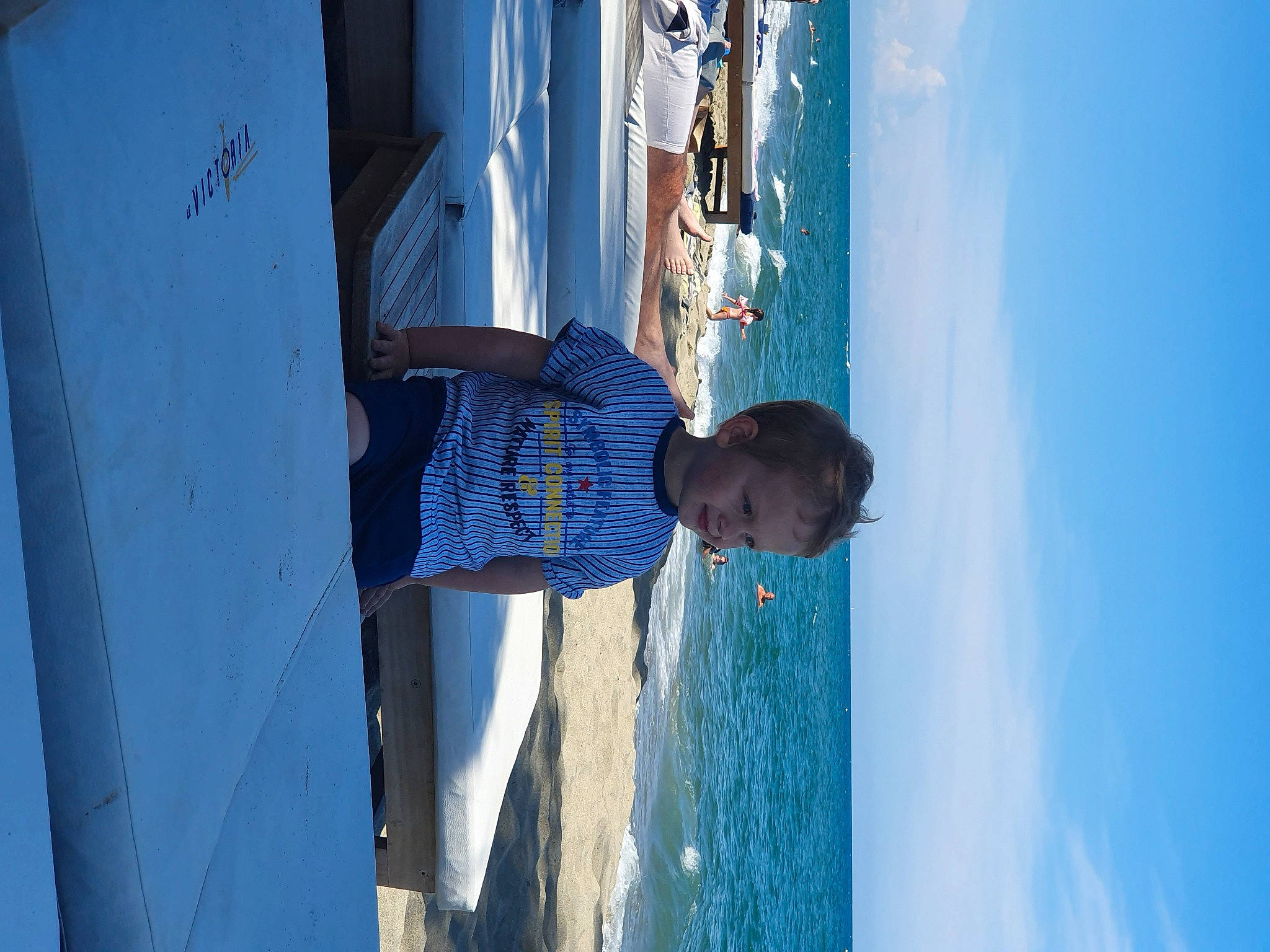 Adrian participe au concours pour gagner de l'argent avec cette photo : azure, blue, boat, building, cloud, door, elbow, electric_blue, facade, fun, leisure, line, person, recreation, sky, t_shirt, travel, vacation, water, wood