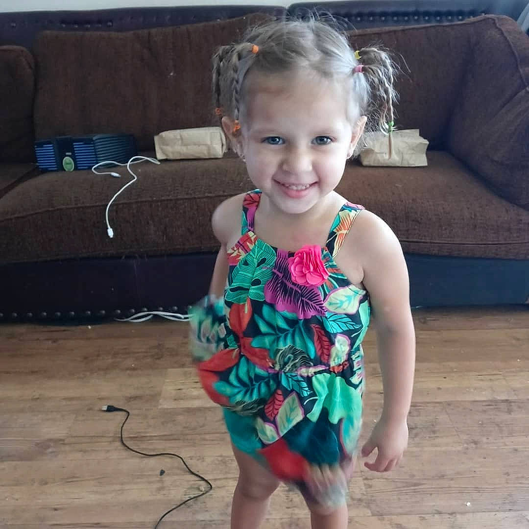 Elissa is registered to the contest to win money with this photo: baby_toddler_clothing, cool, couch, dress, furniture, hair, hairstyle, happy, head, human_body, joy, leg, mammal, neck, person, shoulder, skin, sleeve, smile, textile