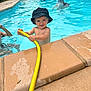 Isaac participe au concours pour gagner de l'argent avec cette photo : blue, bubbles, child, daylight, fun, goggles, greenery, hat, hose, outdoor, person, play, pool, splash, summer, swimming, swimwear, tile, toddler, water