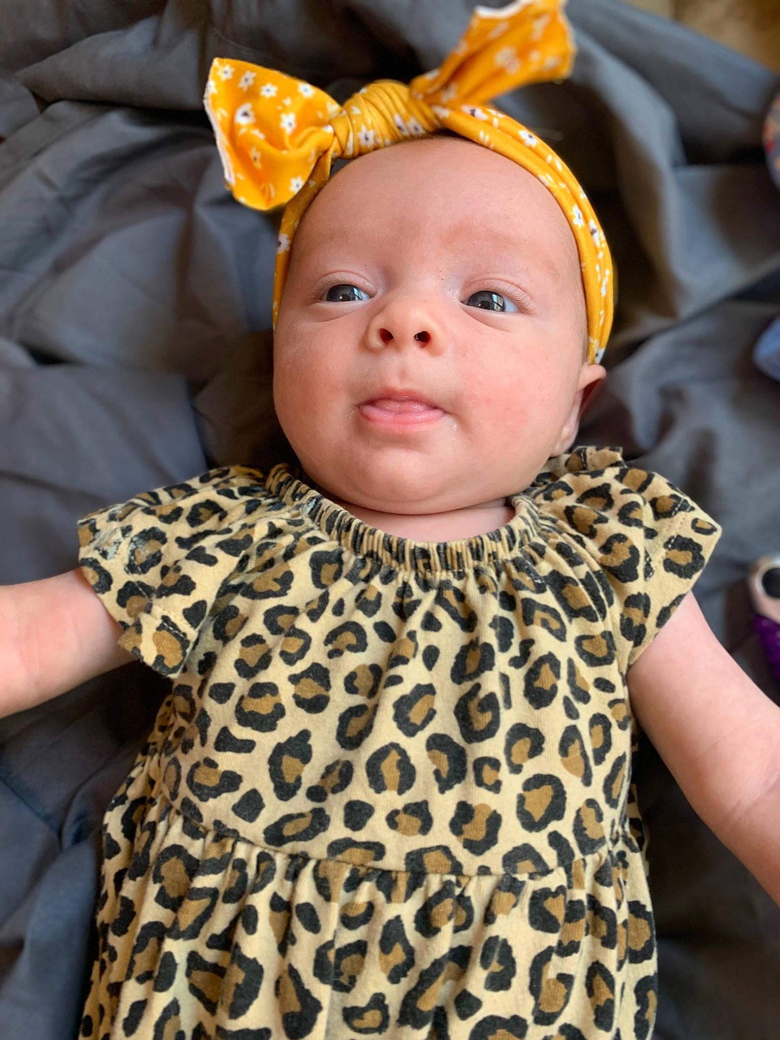 Olivia is registered to the contest to win money with this photo: baby, baby_products, baby_toddler_clothing, child, costume_hat, dress, fashion_accessory, fun, happy, headband, iris, magenta, outerwear, pattern, person, skin, sleeve, t_shirt, toddler, white
