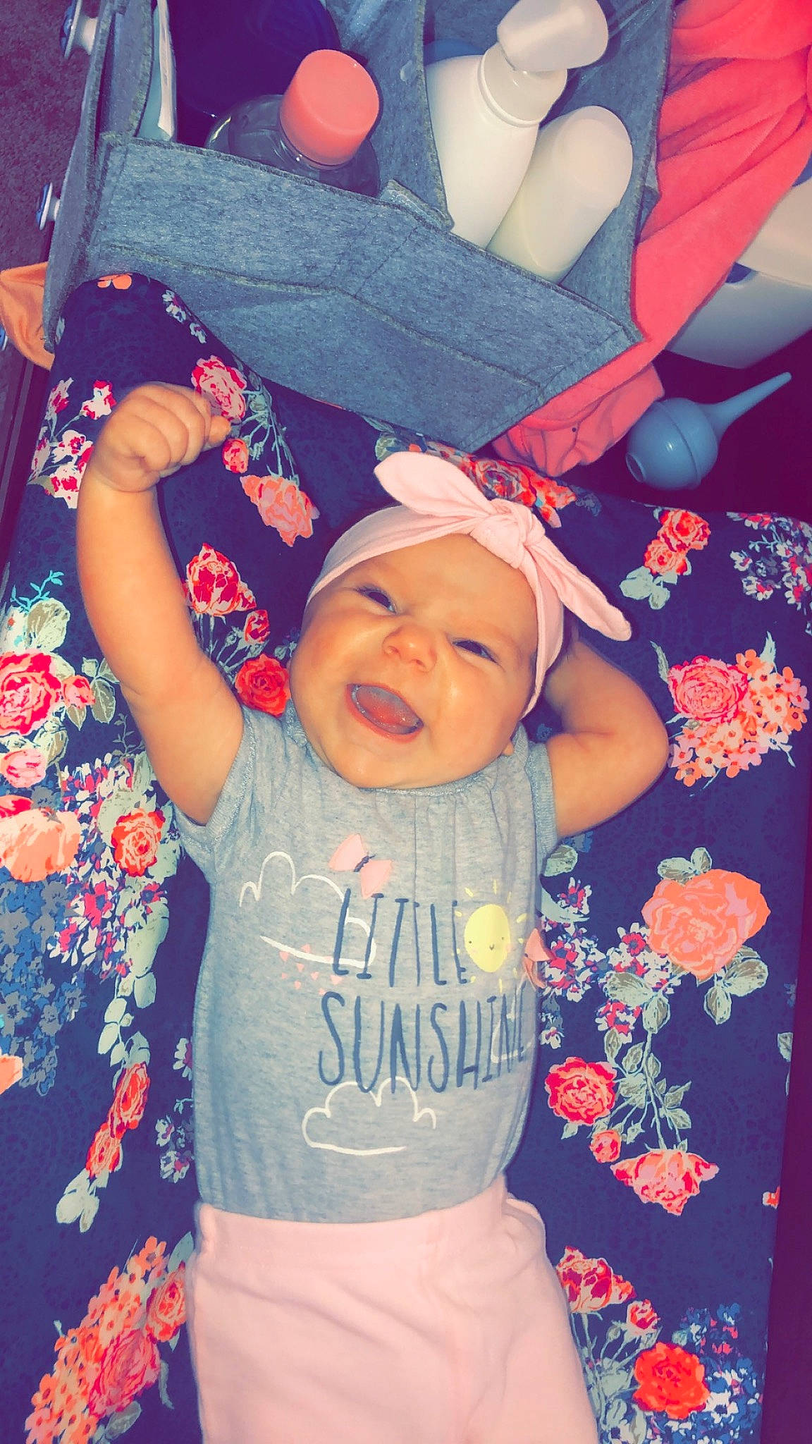 Blakely is registered to the contest to win money with this photo: arm, baby, cheek, child, cool, ear, fashion_accessory, fun, gesture, hand, happy, head, headgear, pattern, person, photography, pink, play, smile, t_shirt