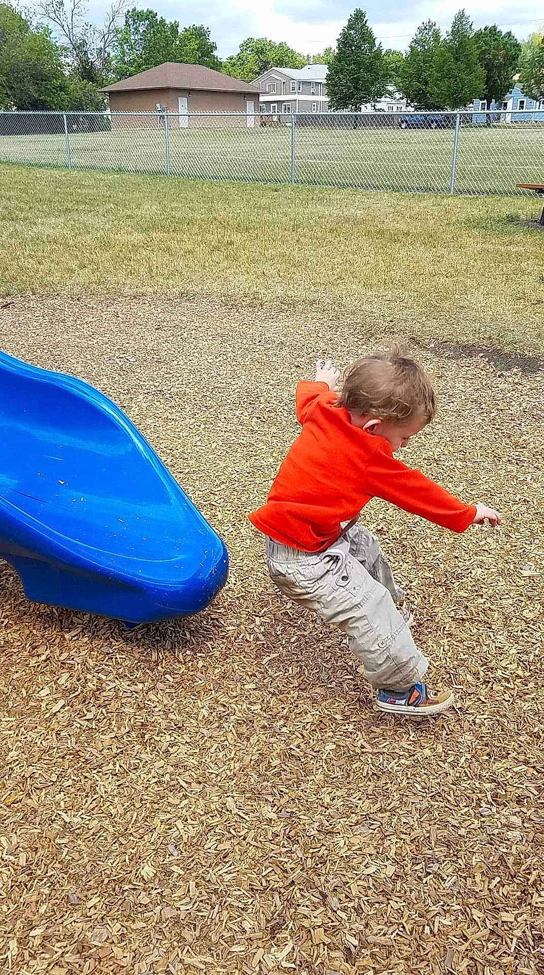 Alexander is registered to the contest to win money with this photo: child, chute, city, fun, grass, human_settlement, leisure, outdoor_play_equipment, person, play, playground, playground_slide, public_space, recreation, toddler