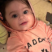 Anaya Maria joined the competition — help win amazing prizes! baby, infant, hoodie, peach_color, smiling, face, cute, child, soft_toys, blanket, indoor, portrait, young_child, clothing, apparel, person, lying_down, happy, expression, warm