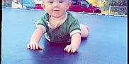 Lunna Rose joined the competition — help win amazing prizes! baby, child, trampoline, toy_car, outdoor, green_shirt, crawling, smiling, backyard, trees, basketball_hoop, car, daylight, fence, curious, playtime, cute, heart_doodle, sunny, portrait