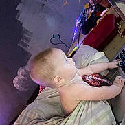 Lunna Rose joined the competition — help win amazing prizes! baby, blanket, laptop, indoor, child, curious, technology, wall_art, heart, cloud, purple_light, furniture, cushion, person, hands, head, skin, room, soft_light, bed