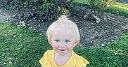 Lunna Rose Rebel joined the competition — help win amazing prizes! toddler, child, smiling, yellow_top, floral_skirt, blonde_hair, blue_eyes, grass, garden, roses, flowers, outdoor, sunlight, greenery, nature, cute, happy, portrait, standing, summer
