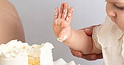 Giulyana a rejoint le concours — aidez-le/la à gagner de superbes lots ! baby, child, cake, frosting, hand, adult, support, white, plate, celebration, food, dessert, curious, messy, closeup, portrait, indoor, light, holding, cute