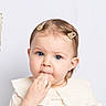 Giulyana a rejoint le concours — aidez-le/la à gagner de superbes lots ! toddler, child, baby, face, blue_eyes, hair_clip, hand, fingers, white_background, balloon, curious, innocent, portrait, cute, expression, young_child, indoor, clothing, person, closeup
