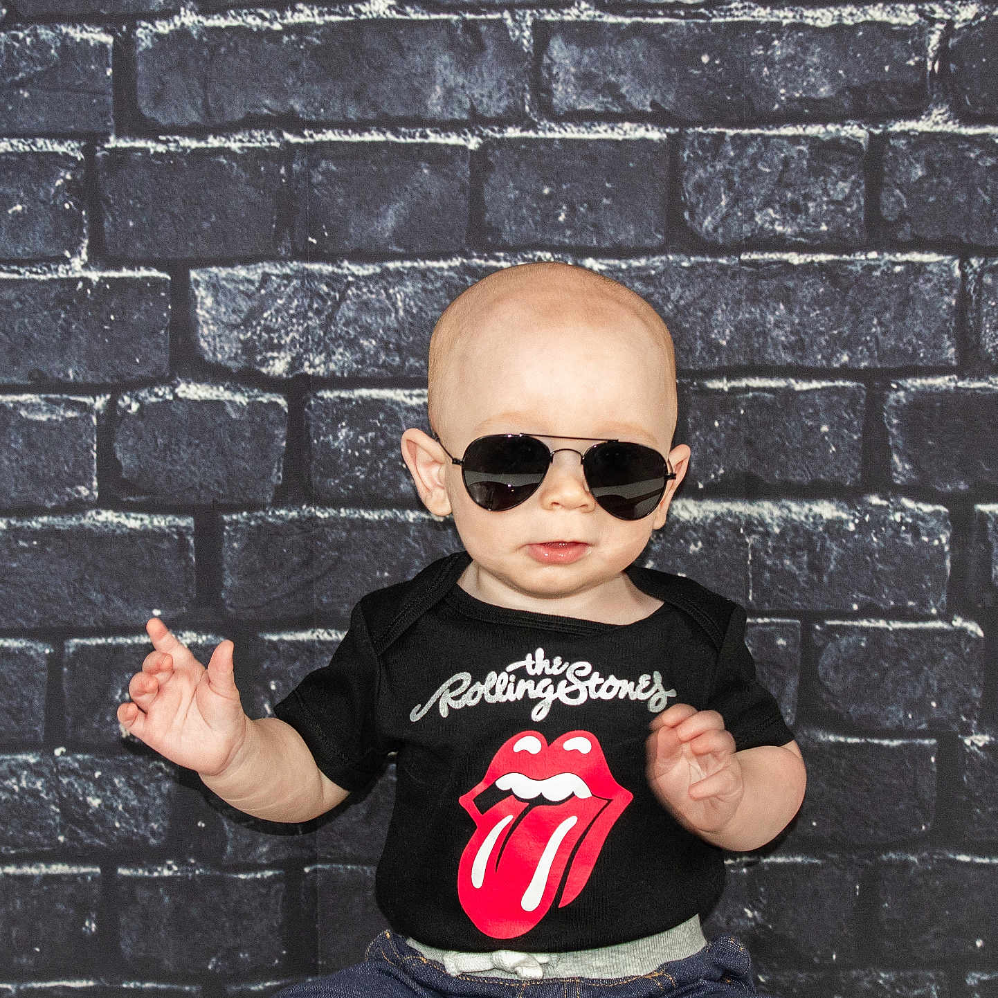 Memphis joined the competition — help win amazing prizes! accessories, architecture, baby, bodypart, brick, building, clothing, face, finger, glasses, hand, head, pants, person, photography, portrait, sitting, sunglasses, t_shirt, wall