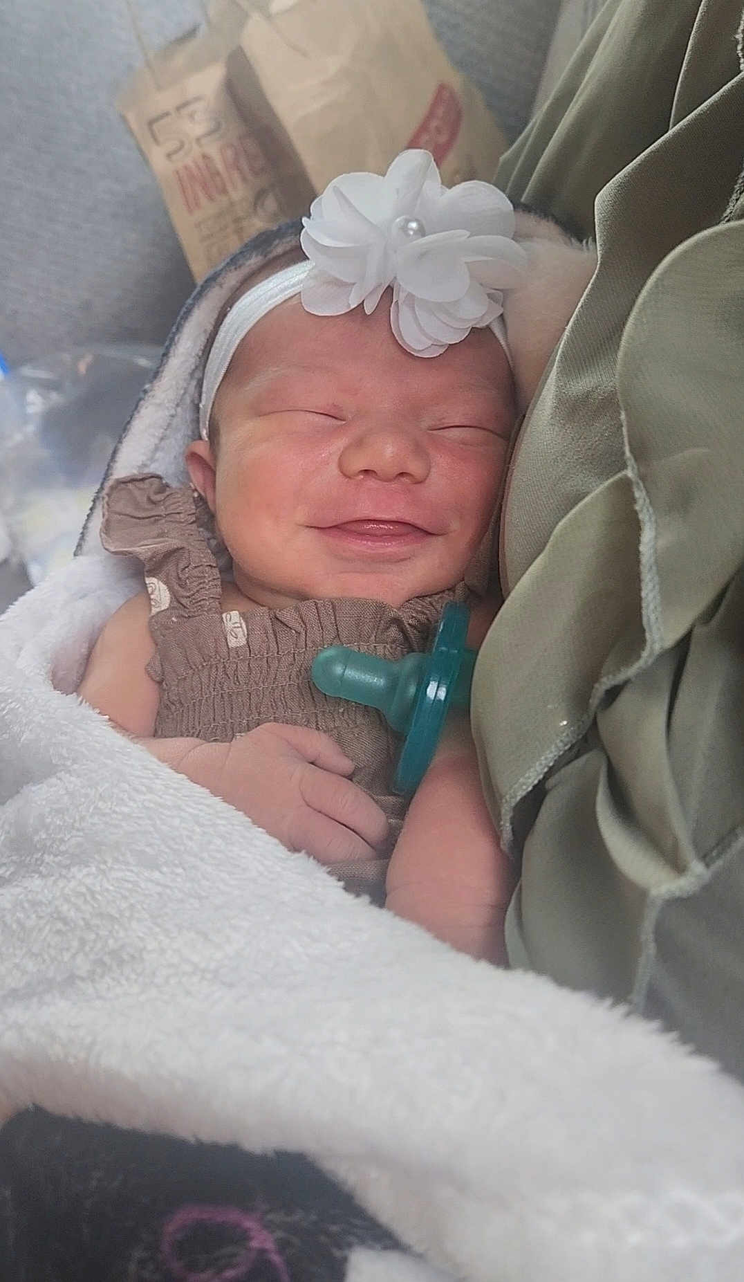 Hellena is registered to the contest to win money with this photo: newborn, baby, smiling, headband, flower, pacifier, blanket, sleeping, closeup, infant, cute, cozy, wrapped, hand, soft, fabric, child, peaceful, portrait, indoors