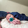 Hellena is registered to the contest to win money with this photo: baby, pacifier, pillow, blanket, infant, resting, face, skin, hand, cute, child, indoor, comfort, newborn, portrait, expression, lying_down, soft, cozy, curious