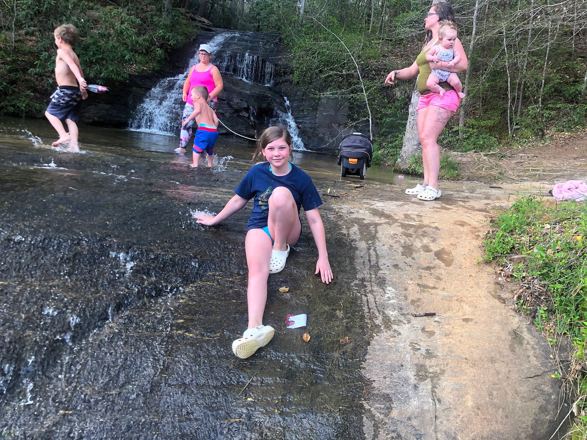 Alexis is registered to the contest to win money with this photo: adventure, child, fun, headwear, joy, leisure, mud, person, plant, play, recreation, soil, state_park, stream, style, summer, vacation, water