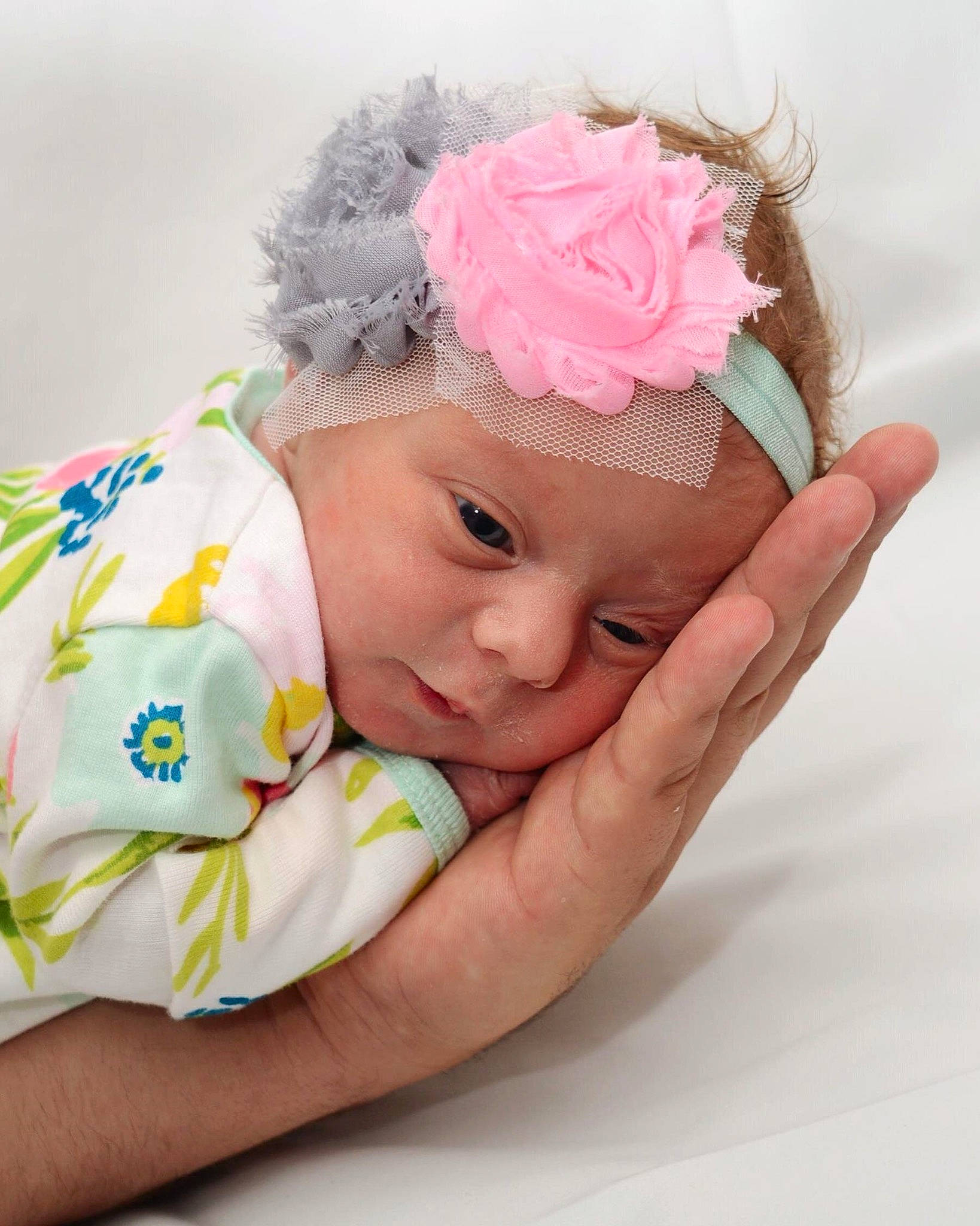 Raelee is registered to the contest to win money with this photo: baby, baby_sleeping, baby_toddler_clothing, child, fashion_accessory, hair_accessory, hand, headband, headgear, headpiece, person, pink, toddler