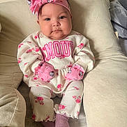 Viviana joined the competition — help win amazing prizes! baby, baby_socks, beige, child, clothing, comfortable, cushion, cute, face, floral_clothing, headband, indoors, infant, mittens, person, pink, portrait, sitting, soft_lighting, young_child