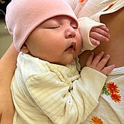 Viviana joined the competition — help win amazing prizes! baby, sleeping, pink_hat, infant, close_up, cozy, striped_clothing, person, hand, skin, floral_pattern, comfort, nap, peaceful, soft_texture, rest, indoor, holding, cute, newborn
