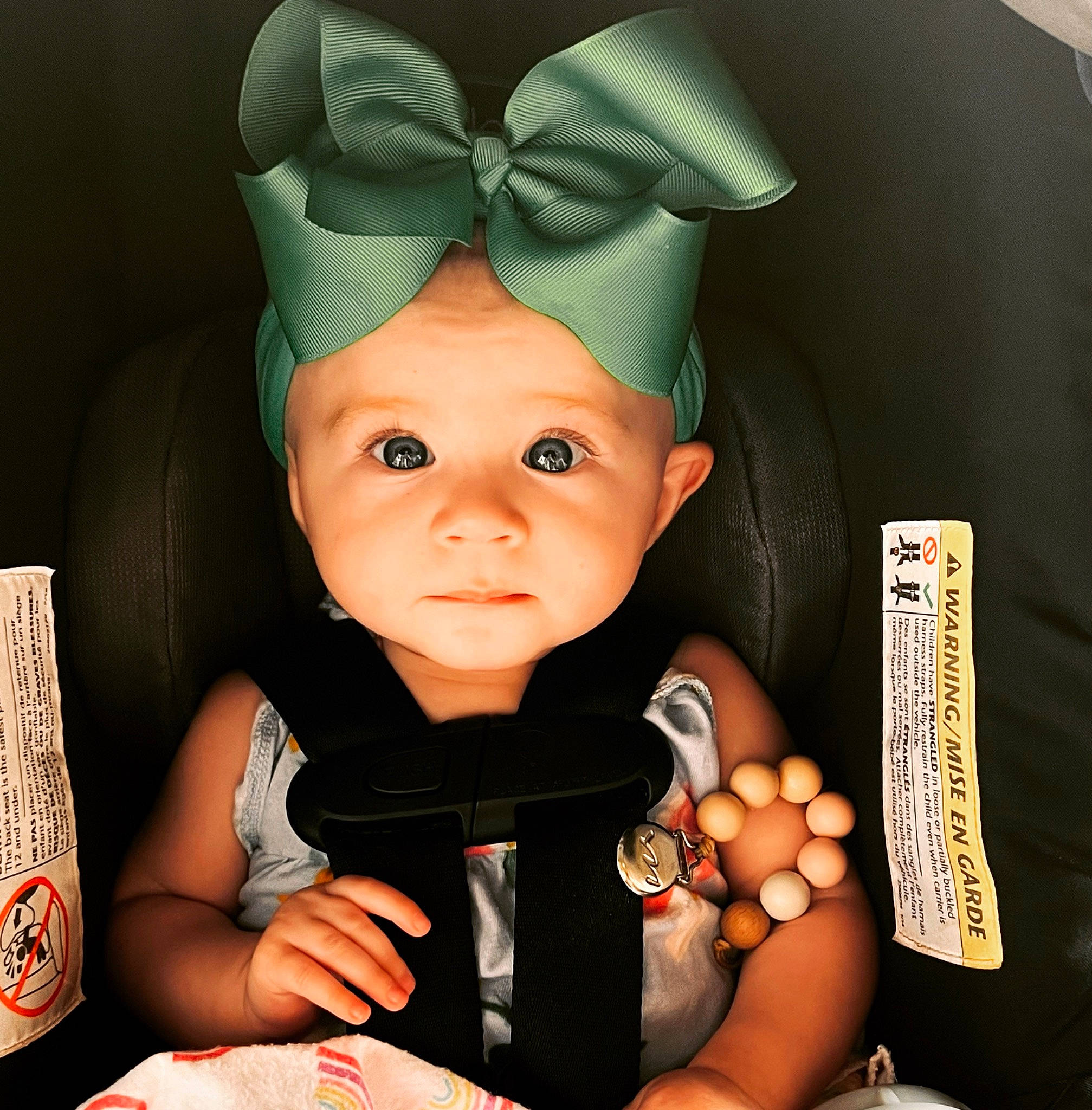 Elvie joined the competition — help win amazing prizes! baby, baby_products, baby_toddler_clothing, cap, car_seat, cheek, child, costume_hat, doll, drinkware, fashion_accessory, fictional_character, finger, head, headgear, headwear, nail, person, room, thumb
