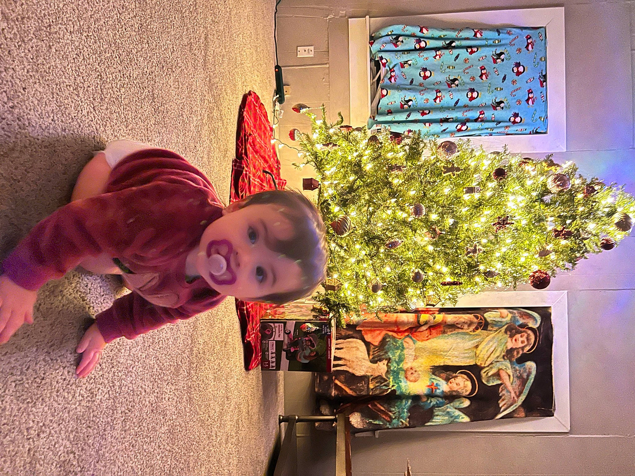 Amia is registered to the contest to win money with this photo: art, baby, baby_toddler_clothing, child, flooring, fun, hat, holiday, houseplant, leaf, magenta, person, picture_frame, plant, purple, rectangle, room, toddler, tree, visual_arts