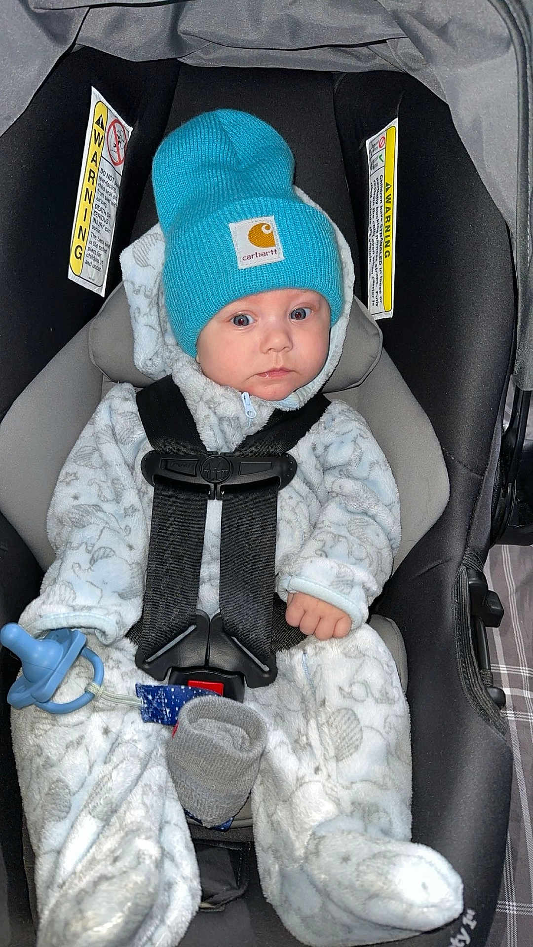 Matthew joined the competition — help win amazing prizes! baby, car_seat, blue_hat, onesie, pacifier, infant, straps, cozy, child, clothing, indoor, seat, cute, young, face, looking, warm, hat, hands, safety