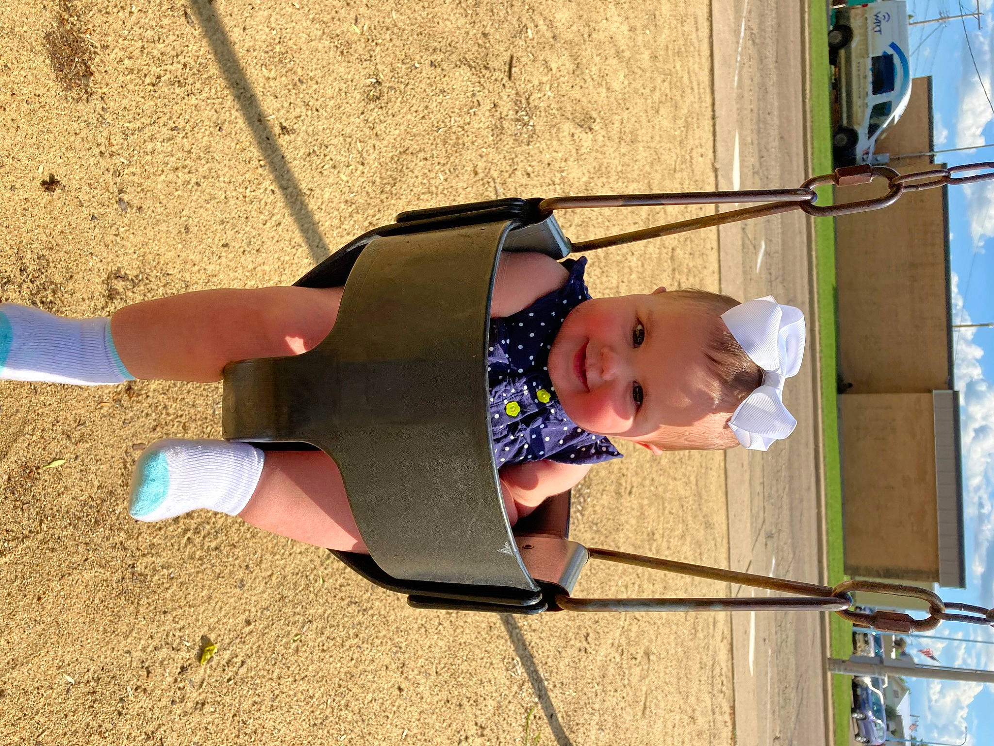 Noa Grace is registered to the contest to win money with this photo: baby, baby_toddler_clothing, child, city, fun, hat, human_leg, joy, knee, leisure, outdoor_play_equipment, person, play, playground, recreation, shadow, sky, sock, thigh, toddler
