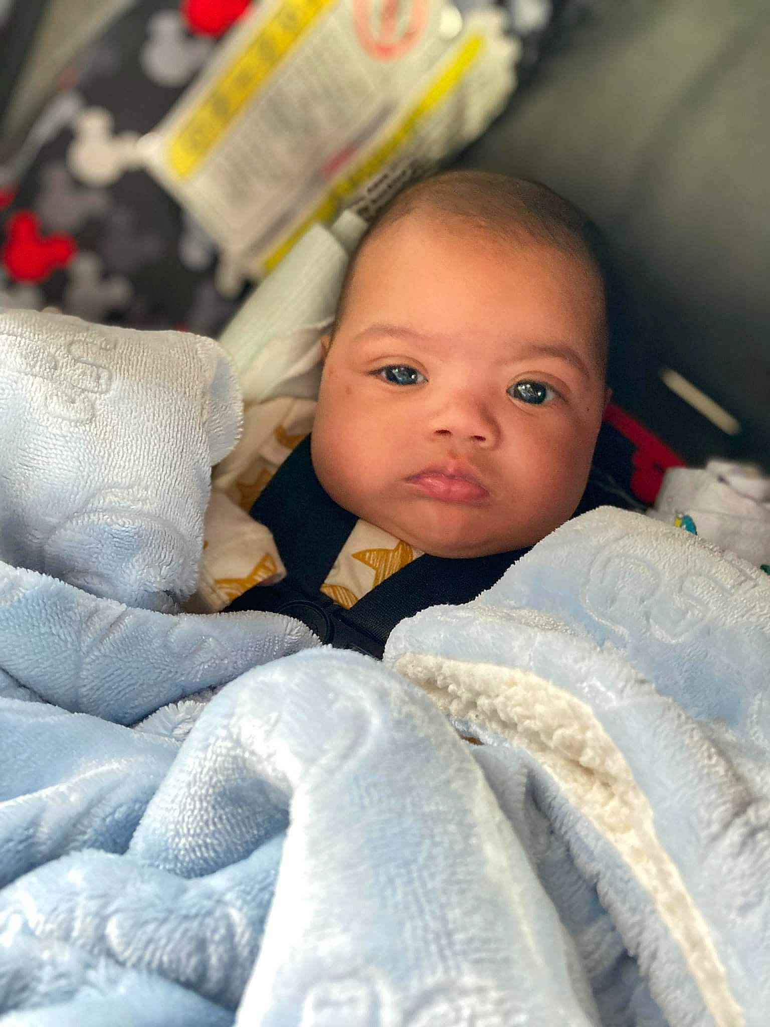 Kyson is registered to the contest to win money with this photo: baby, baby_toddler_clothing, bedding, bedtime, blanket, cheek, child, close_up, comfort, face, fur, grey, happy, linens, nose, person, skin, sleeve, smile, textile